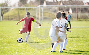 Kids soccer football - children players match on soccer field