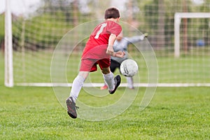 Kids soccer football - children players match on soccer field