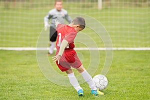 Kids soccer football - children players match on soccer field