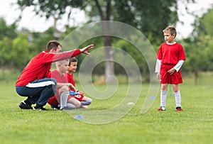 Kids soccer football - children players match on soccer field