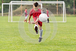 Kids soccer football - children players match on soccer field