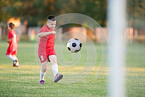 Kids soccer football - children players match on soccer field