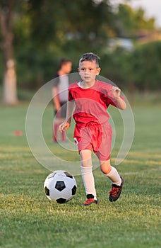 Kids soccer football - children players match on soccer field