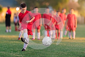 Kids soccer football - children players match on soccer field