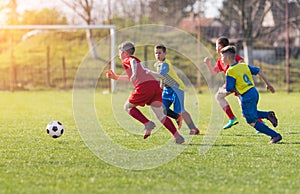 Kids soccer football - children players match on soccer field