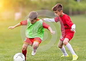 Kids soccer football - children players match on soccer field