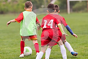 Kids soccer football - children players match on soccer field