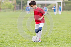 Kids soccer football - children players match on soccer field