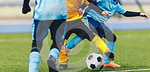 Kids Soccer Players Legs. Children Compete in a Football Game. Footballers in Winter Uniforms