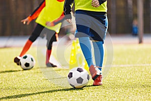 Kids in soccer winter clothing at training drill during winter practice camp