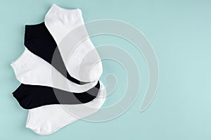 Kids socks composition on blue background. Flat lay