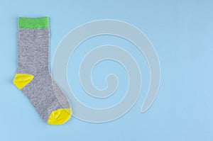 Kids socks composition on blue background. Flat lay