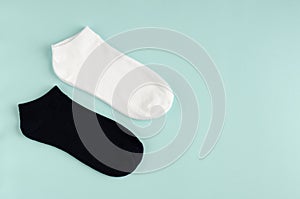 Kids socks composition on blue background. Flat lay