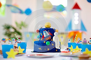 Kids space theme birthday party with cake