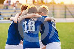 Kids in sports team. Happy boys in football team