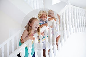 Kids on stairs. Child moving into new home.