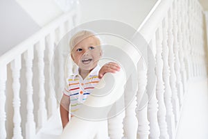 Kids on stairs. Child moving into new home.