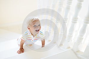 Kids on stairs. Child moving into new home.