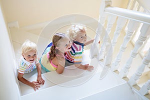 Kids on stairs. Child moving into new home