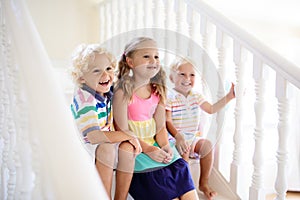 Kids on stairs. Child moving into new home