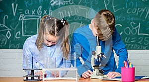 Kids study chemistry. School chemistry lesson. School laboratory. School education. Girl and boy communicate while