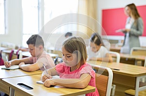 Kids studying in classroom