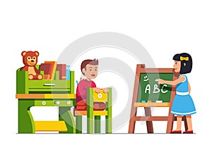 Kids studying at kindergarten classroom