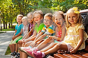 Kids on summer park bench