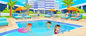 Kids swim in a hotel swimming pool in summer. Family vacation on a resort