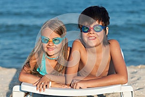 Kids with swimming goggles on the beach