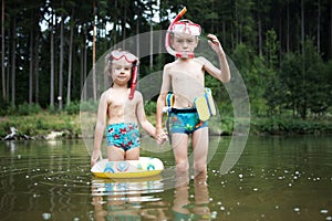 Kids swimming at pond
