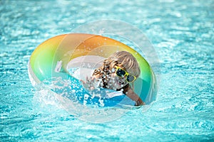 Kids swimming pool. Boy at aquapark. Summer weekend. Summertime vacation.