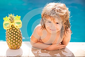 Kids Swimming Pool Concept. Summer vacation. Relax in spa swimming pool. Children playing in pool. Summer pineapple