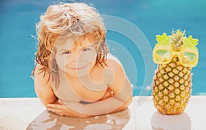 Kids Swimming Pool Concept. Summer vacation. Relax in spa swimming pool. Children playing in pool. Summer pineapple