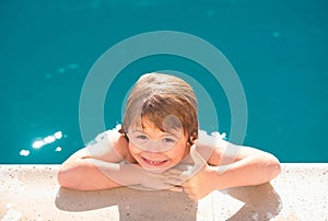 Kids in swimming pool portrait, thumbs up. Kids summer activities.
