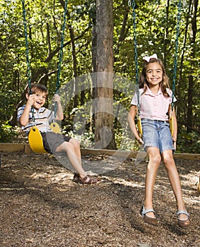 Kids on swing set.