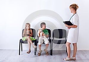 Kids taking their pets to the veterinary doctor