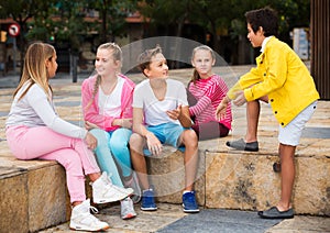 Kids talking on city walk
