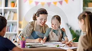 kids and teacher at the art class