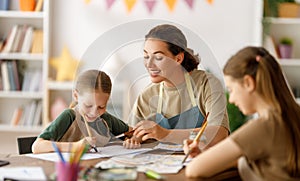 kids and teacher at the art class