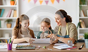 kids and teacher at the art class