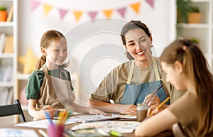 kids and teacher at the art class