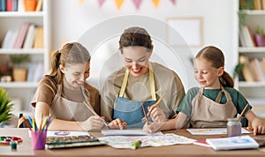 kids and teacher at the art class