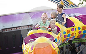 Kids on a thrilling roller coaster ride at an amusement park