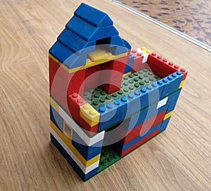 kids toy A house madeup of building blocks by a kid