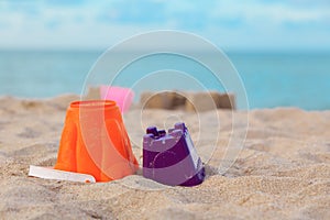 kids toys and castles from sand on beach