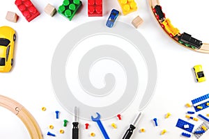 Kids toys frame on white background. Top view. Flat lay.