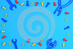 Kids Toys Top View. Colorful Toy Tools on Blue Background