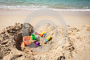 Kids toys on tropical sand beach