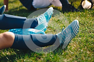 Kids on training session with roller foams. Children soccer football players stretching after workout training